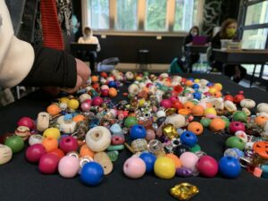 a picture of beads on a table in a classroom